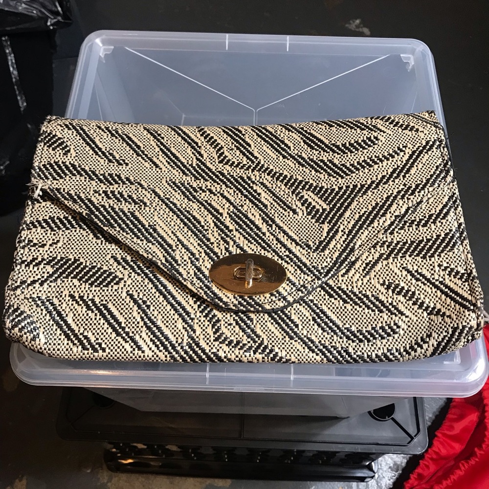 Cream and black clutch
